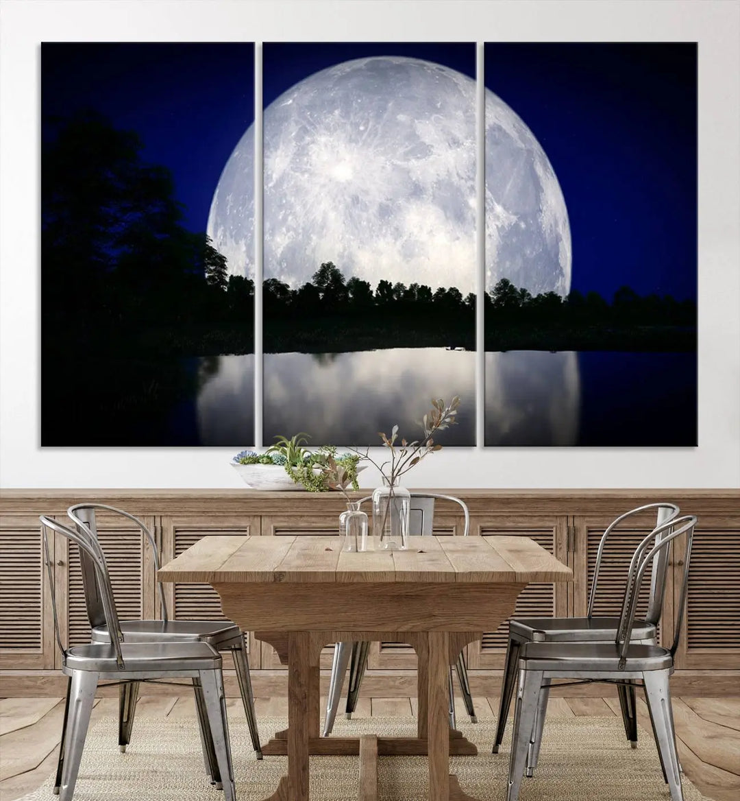 A modern living room showcases a three-panel MoonGlade Wall Art Canvas Print, depicting a moonlit night over a tranquil lake on museum-quality canvases.