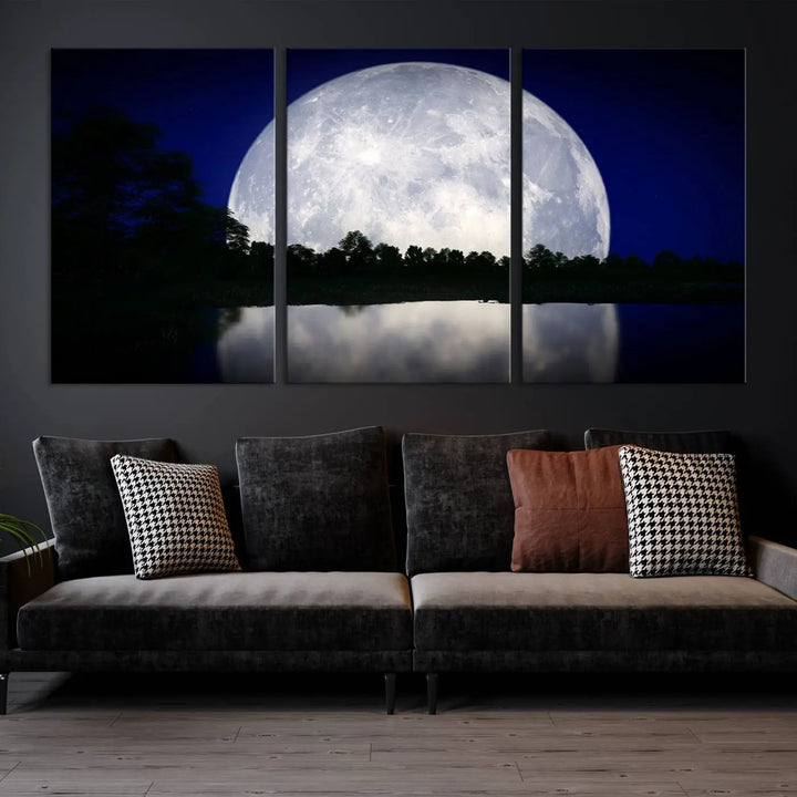 A modern living room showcases a three-panel MoonGlade Wall Art Canvas Print, depicting a moonlit night over a tranquil lake on museum-quality canvases.