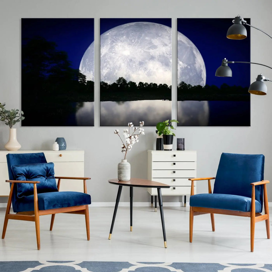 A modern living room showcases a three-panel MoonGlade Wall Art Canvas Print, depicting a moonlit night over a tranquil lake on museum-quality canvases.