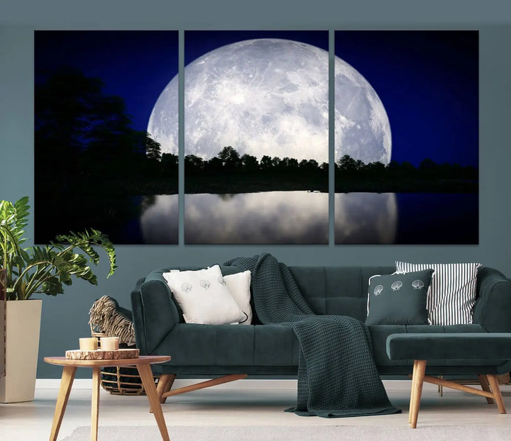 A modern living room showcases a three-panel MoonGlade Wall Art Canvas Print, depicting a moonlit night over a tranquil lake on museum-quality canvases.