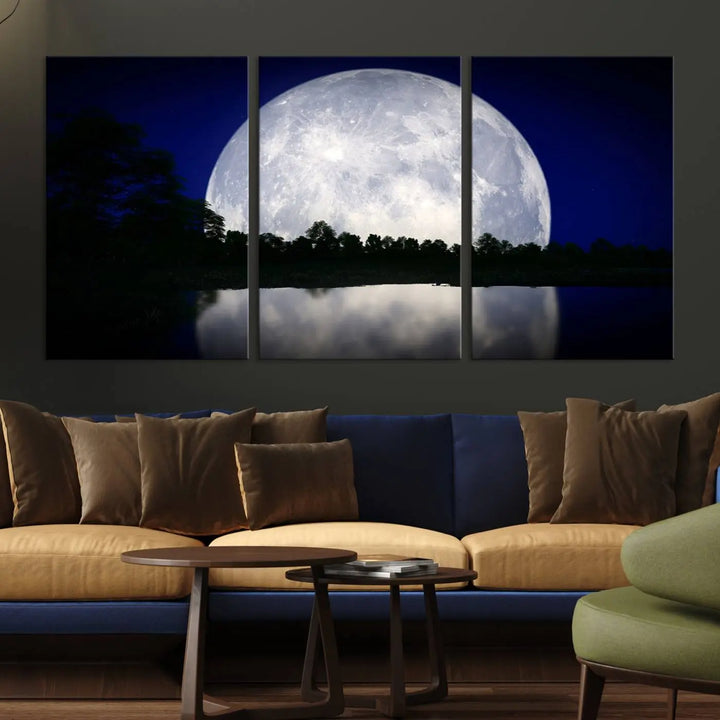 A modern living room showcases a three-panel MoonGlade Wall Art Canvas Print, depicting a moonlit night over a tranquil lake on museum-quality canvases.