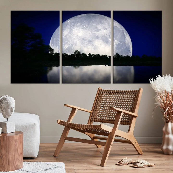 A modern living room showcases a three-panel MoonGlade Wall Art Canvas Print, depicting a moonlit night over a tranquil lake on museum-quality canvases.