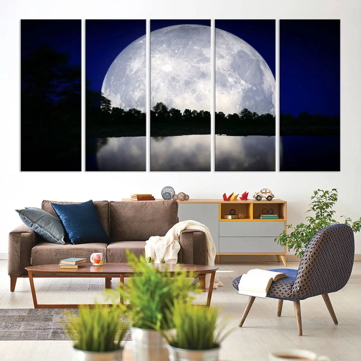 A modern living room showcases a three-panel MoonGlade Wall Art Canvas Print, depicting a moonlit night over a tranquil lake on museum-quality canvases.