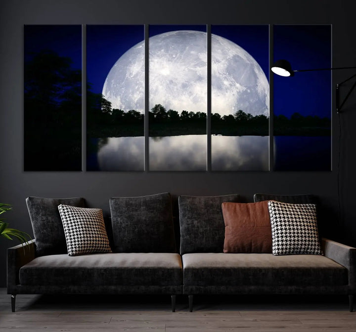 A modern living room showcases a three-panel MoonGlade Wall Art Canvas Print, depicting a moonlit night over a tranquil lake on museum-quality canvases.