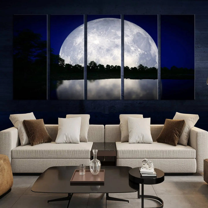 A modern living room showcases a three-panel MoonGlade Wall Art Canvas Print, depicting a moonlit night over a tranquil lake on museum-quality canvases.