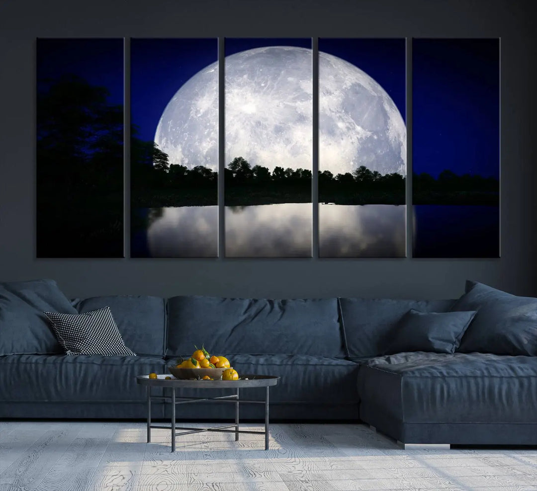 A modern living room showcases a three-panel MoonGlade Wall Art Canvas Print, depicting a moonlit night over a tranquil lake on museum-quality canvases.