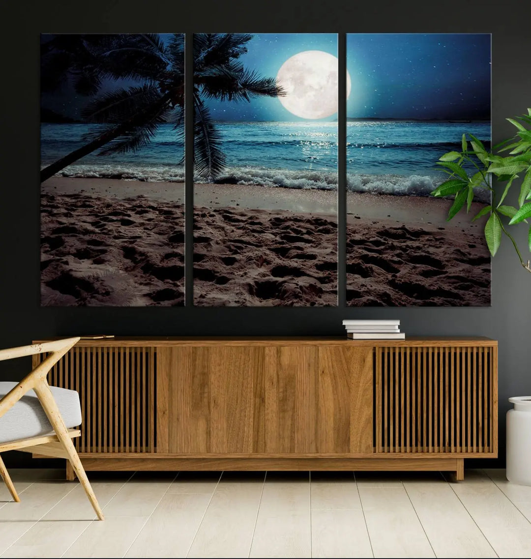 The living room features the Moonglade Coastal Palm Tree Wall Art Canvas Print adorning the wall. This triptych showcases palm trees and ocean waves on museum-quality canvases, enhanced with a UV-protective coating to maintain its vibrant colors.