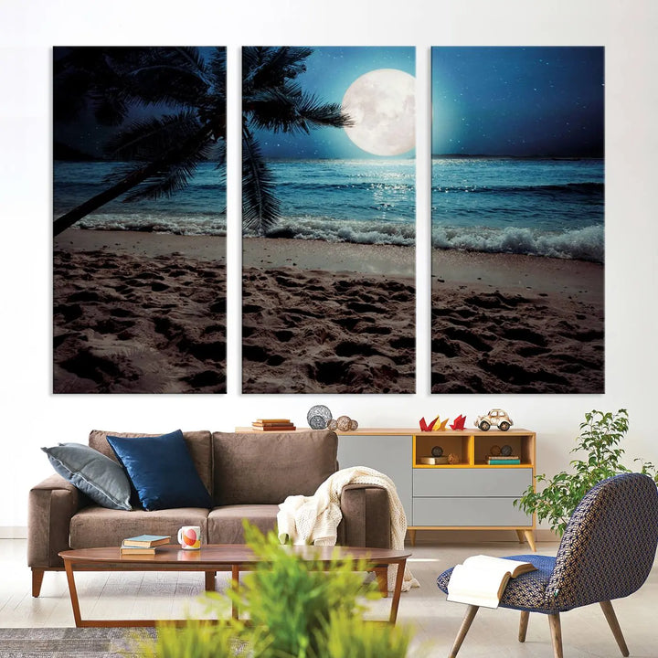 The living room features the Moonglade Coastal Palm Tree Wall Art Canvas Print adorning the wall. This triptych showcases palm trees and ocean waves on museum-quality canvases, enhanced with a UV-protective coating to maintain its vibrant colors.