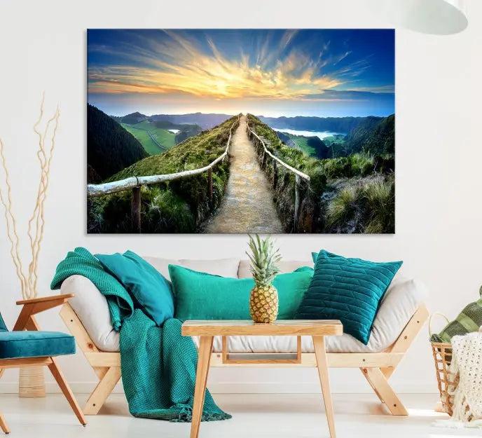 The Mountain Way Wall Art Canvas Print features a triptych of a sunrise over a mountain path. The artwork is gallery wrapped on museum-quality canvas, ensuring every detail shines through with stunning clarity and depth.