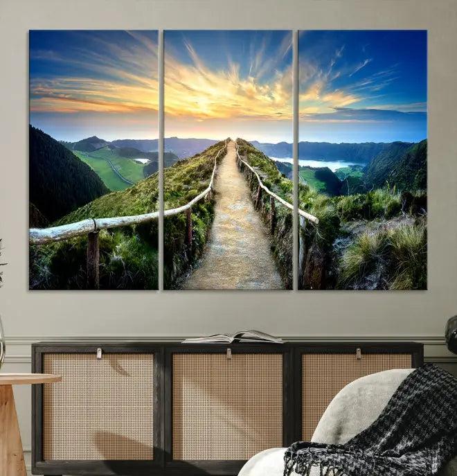 The Mountain Way Wall Art Canvas Print features a triptych of a sunrise over a mountain path. The artwork is gallery wrapped on museum-quality canvas, ensuring every detail shines through with stunning clarity and depth.