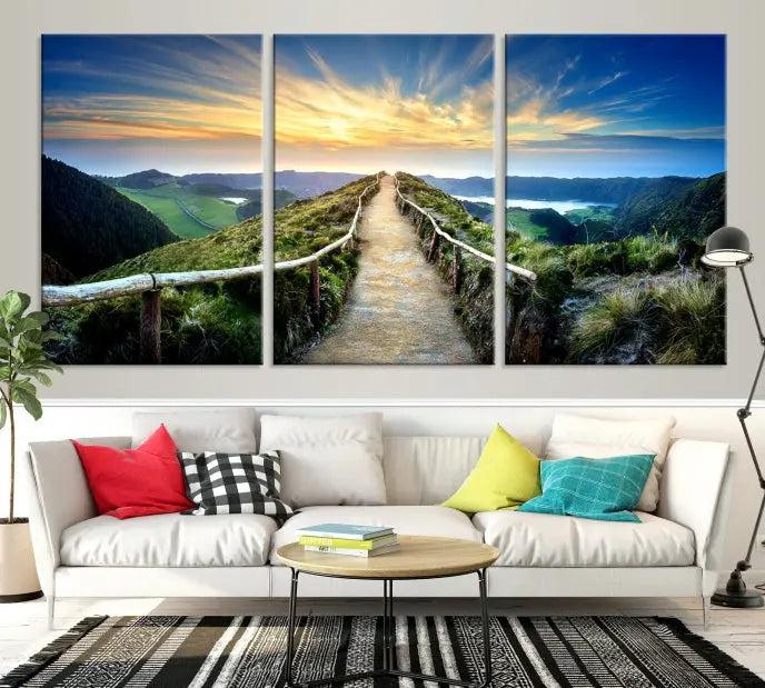 The Mountain Way Wall Art Canvas Print features a triptych of a sunrise over a mountain path. The artwork is gallery wrapped on museum-quality canvas, ensuring every detail shines through with stunning clarity and depth.