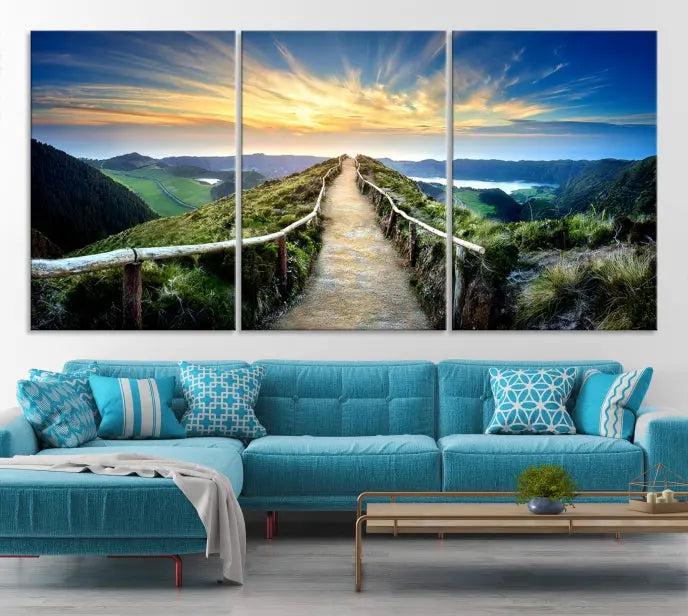 The Mountain Way Wall Art Canvas Print features a triptych of a sunrise over a mountain path. The artwork is gallery wrapped on museum-quality canvas, ensuring every detail shines through with stunning clarity and depth.