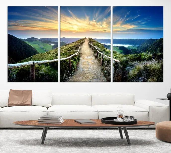 The Mountain Way Wall Art Canvas Print features a triptych of a sunrise over a mountain path. The artwork is gallery wrapped on museum-quality canvas, ensuring every detail shines through with stunning clarity and depth.