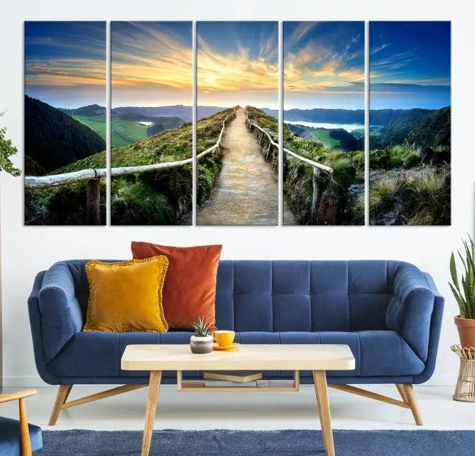 The Mountain Way Wall Art Canvas Print features a triptych of a sunrise over a mountain path. The artwork is gallery wrapped on museum-quality canvas, ensuring every detail shines through with stunning clarity and depth.