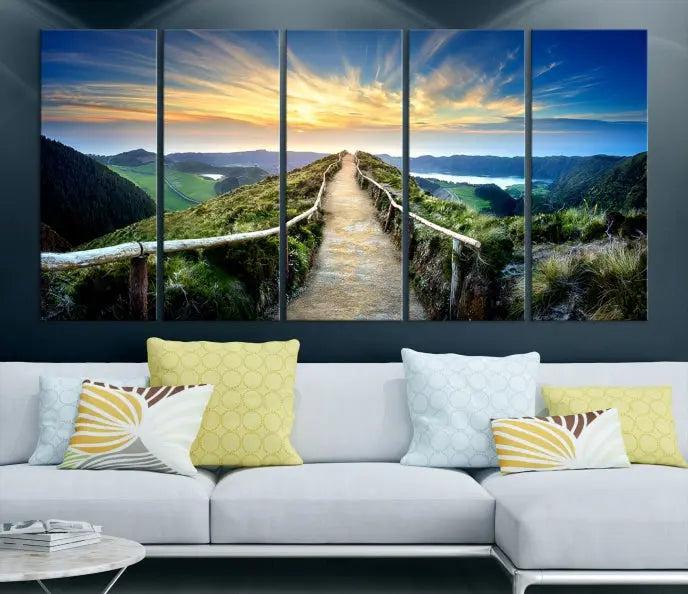 The Mountain Way Wall Art Canvas Print features a triptych of a sunrise over a mountain path. The artwork is gallery wrapped on museum-quality canvas, ensuring every detail shines through with stunning clarity and depth.