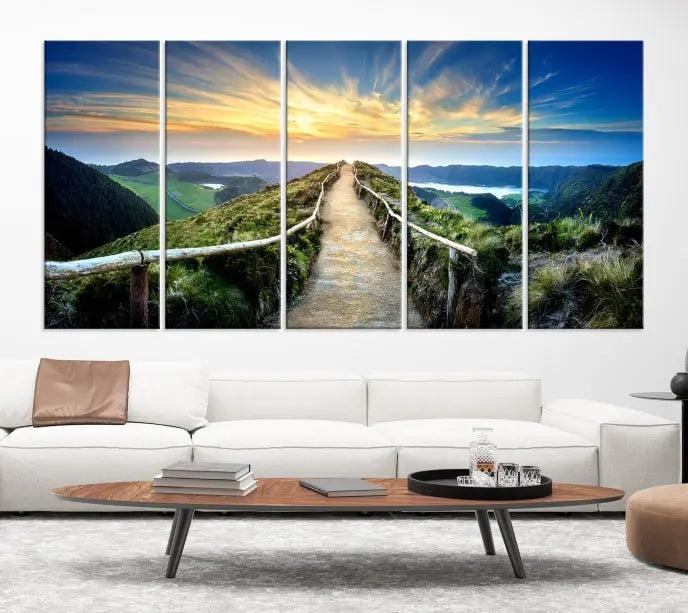 The Mountain Way Wall Art Canvas Print features a triptych of a sunrise over a mountain path. The artwork is gallery wrapped on museum-quality canvas, ensuring every detail shines through with stunning clarity and depth.