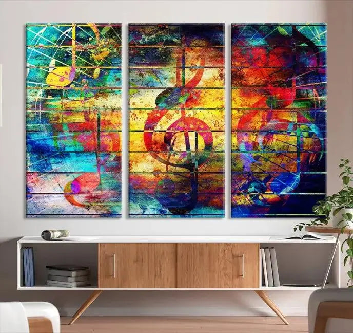 The Music Left Switch Abstract Wall Art Canvas Print features three panels of vibrant colors and music notes. Crafted on museum-quality canvases with a UV-protective coating, it offers lasting elegance.