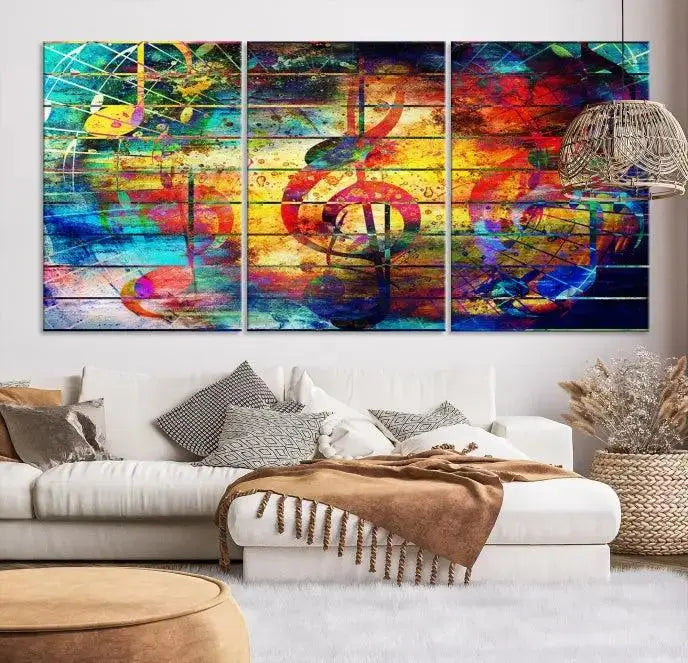 The Music Left Switch Abstract Wall Art Canvas Print features three panels of vibrant colors and music notes. Crafted on museum-quality canvases with a UV-protective coating, it offers lasting elegance.