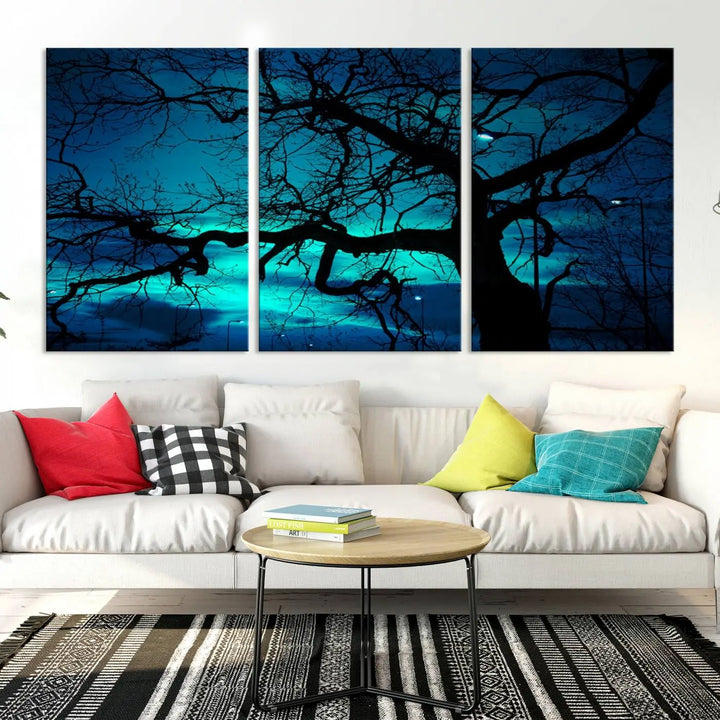 The Mystic Dark Forest Tree Wall Art Canvas Print showcases a tree silhouette set against a teal sky. Crafted on museum-quality canvas and gallery wrapped, it includes a UV-protective coating for lasting vibrancy.