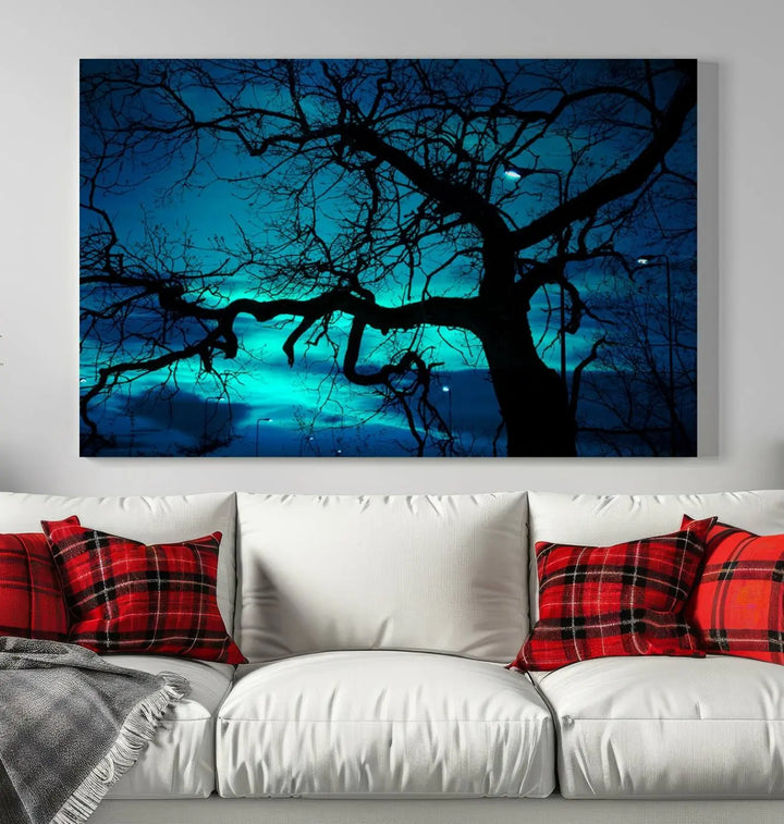 The Mystic Dark Forest Tree Wall Art Canvas Print showcases a tree silhouette set against a teal sky. Crafted on museum-quality canvas and gallery wrapped, it includes a UV-protective coating for lasting vibrancy.