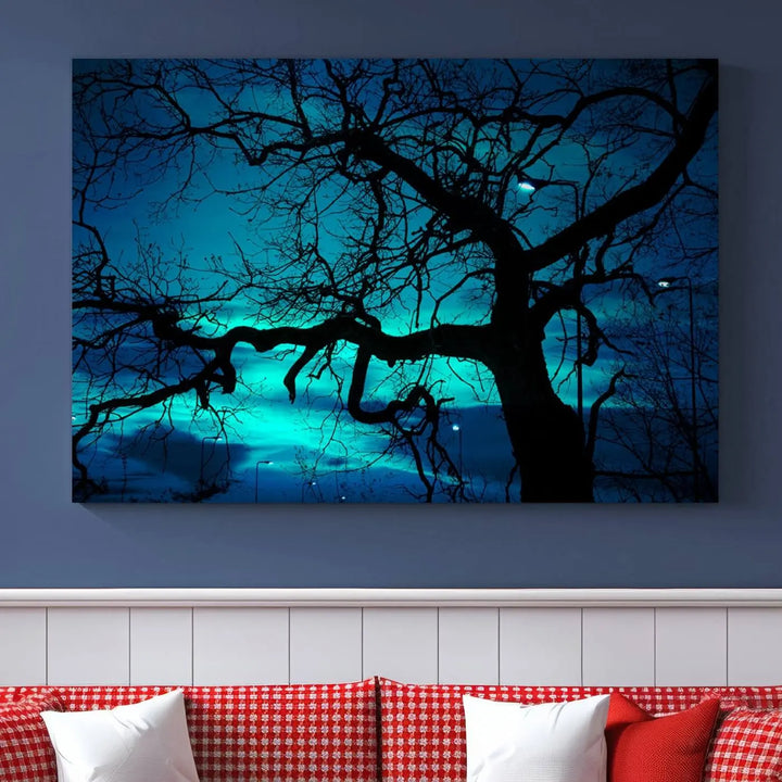 The Mystic Dark Forest Tree Wall Art Canvas Print showcases a tree silhouette set against a teal sky. Crafted on museum-quality canvas and gallery wrapped, it includes a UV-protective coating for lasting vibrancy.