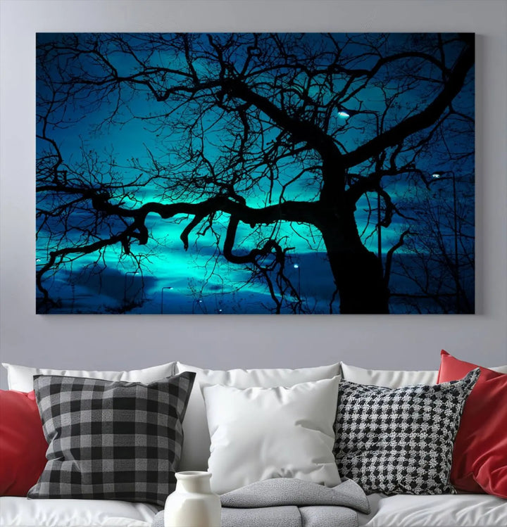 The Mystic Dark Forest Tree Wall Art Canvas Print showcases a tree silhouette set against a teal sky. Crafted on museum-quality canvas and gallery wrapped, it includes a UV-protective coating for lasting vibrancy.