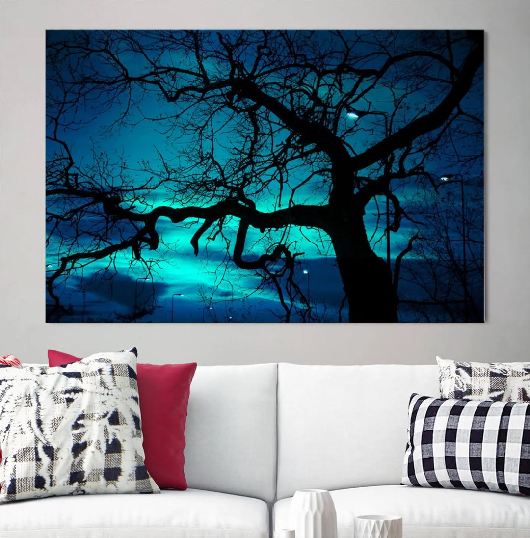 The Mystic Dark Forest Tree Wall Art Canvas Print showcases a tree silhouette set against a teal sky. Crafted on museum-quality canvas and gallery wrapped, it includes a UV-protective coating for lasting vibrancy.