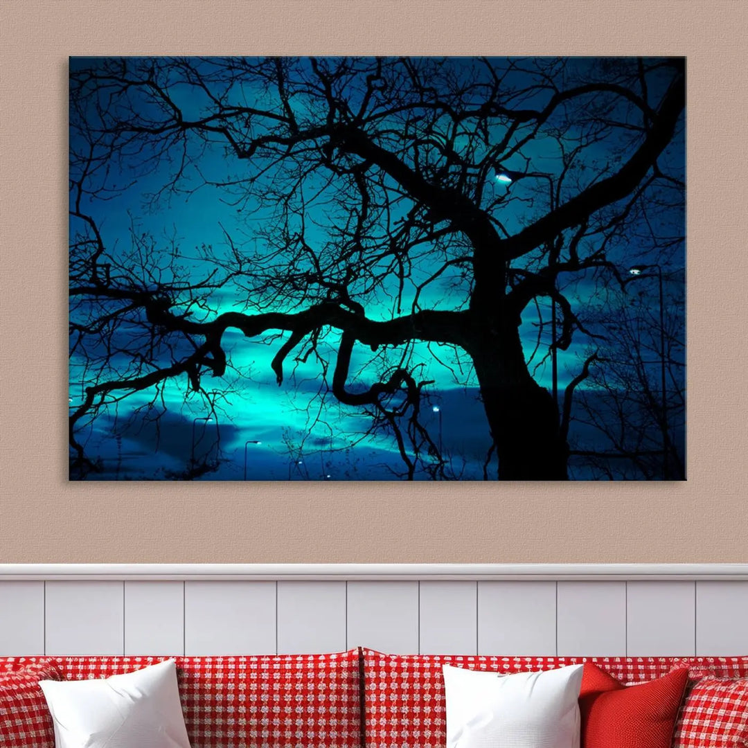 The Mystic Dark Forest Tree Wall Art Canvas Print showcases a tree silhouette set against a teal sky. Crafted on museum-quality canvas and gallery wrapped, it includes a UV-protective coating for lasting vibrancy.