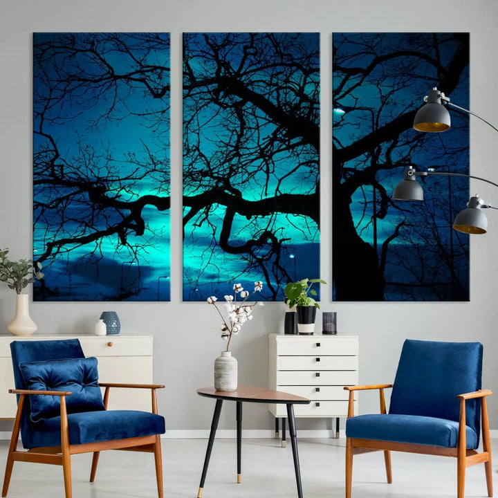 The Mystic Dark Forest Tree Wall Art Canvas Print showcases a tree silhouette set against a teal sky. Crafted on museum-quality canvas and gallery wrapped, it includes a UV-protective coating for lasting vibrancy.