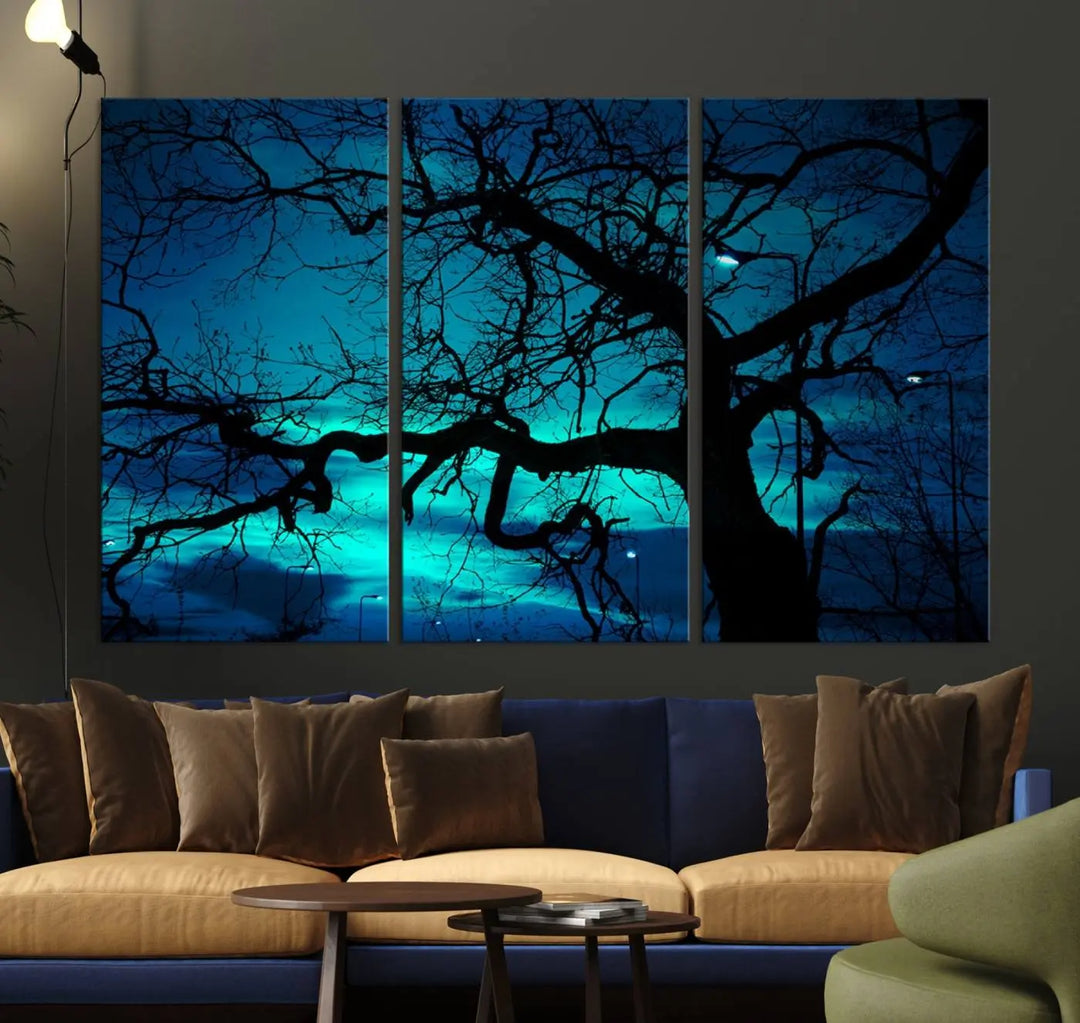 The Mystic Dark Forest Tree Wall Art Canvas Print showcases a tree silhouette set against a teal sky. Crafted on museum-quality canvas and gallery wrapped, it includes a UV-protective coating for lasting vibrancy.