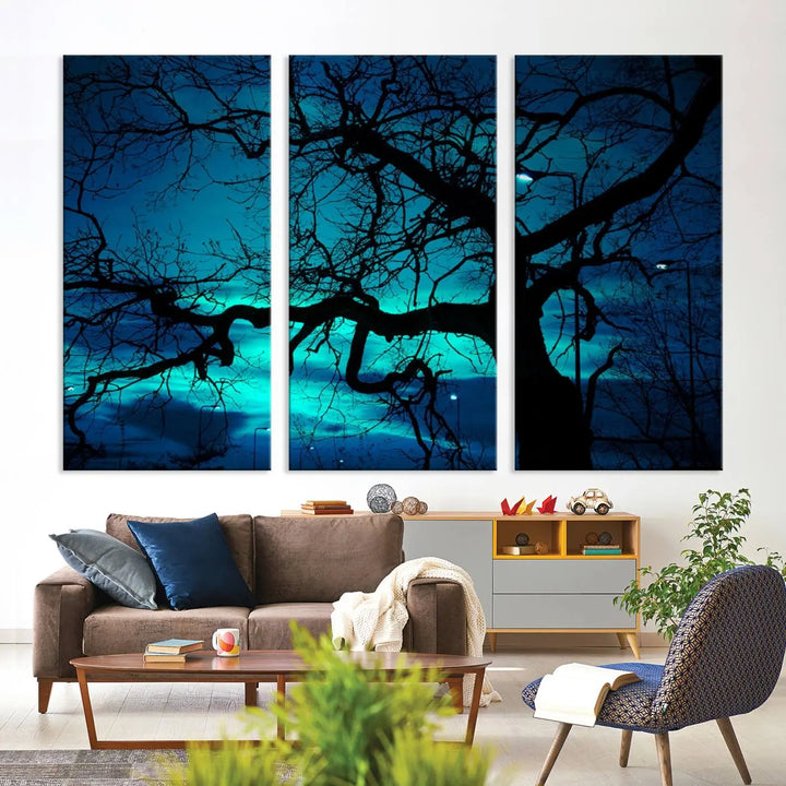 The Mystic Dark Forest Tree Wall Art Canvas Print showcases a tree silhouette set against a teal sky. Crafted on museum-quality canvas and gallery wrapped, it includes a UV-protective coating for lasting vibrancy.