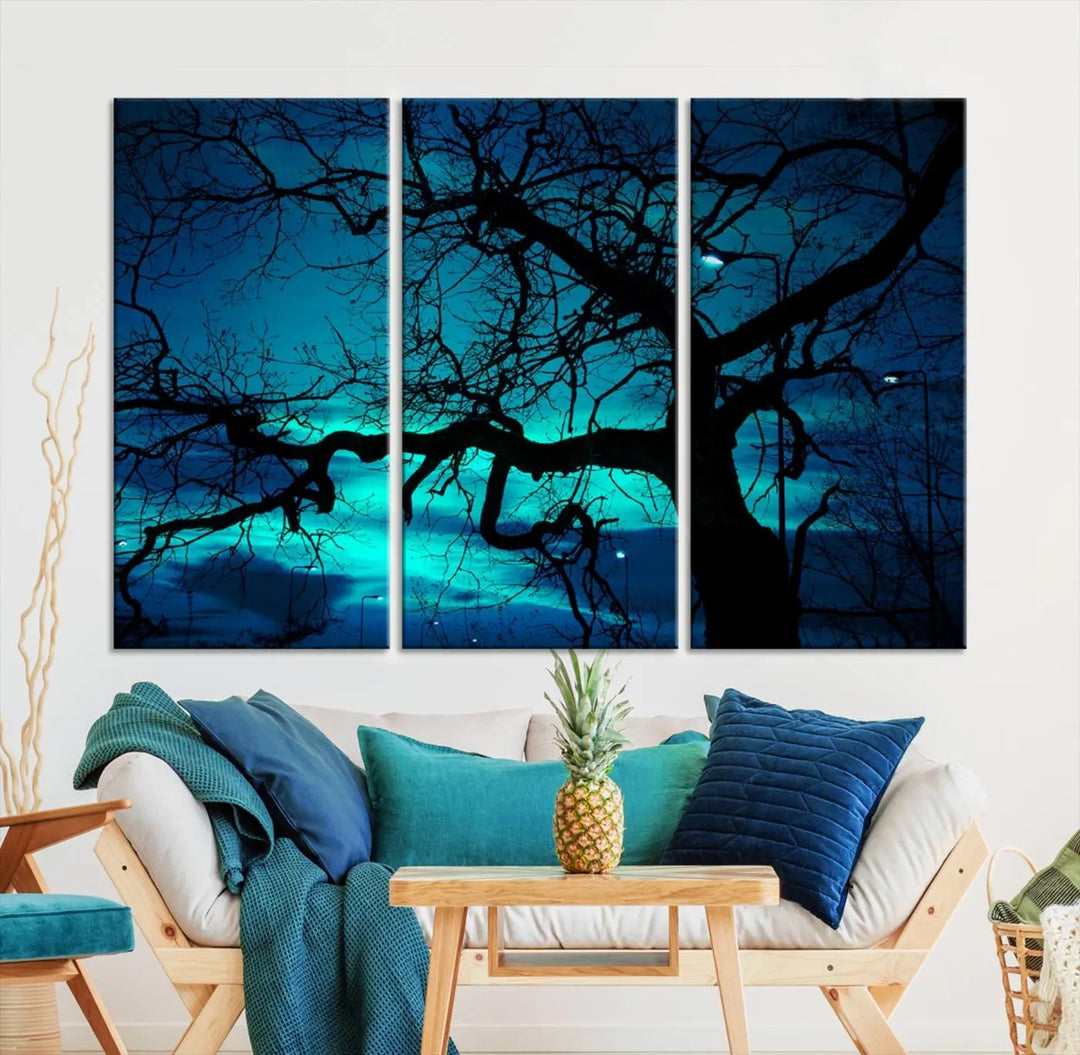 The Mystic Dark Forest Tree Wall Art Canvas Print showcases a tree silhouette set against a teal sky. Crafted on museum-quality canvas and gallery wrapped, it includes a UV-protective coating for lasting vibrancy.