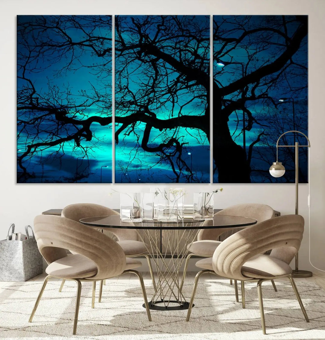 The Mystic Dark Forest Tree Wall Art Canvas Print showcases a tree silhouette set against a teal sky. Crafted on museum-quality canvas and gallery wrapped, it includes a UV-protective coating for lasting vibrancy.