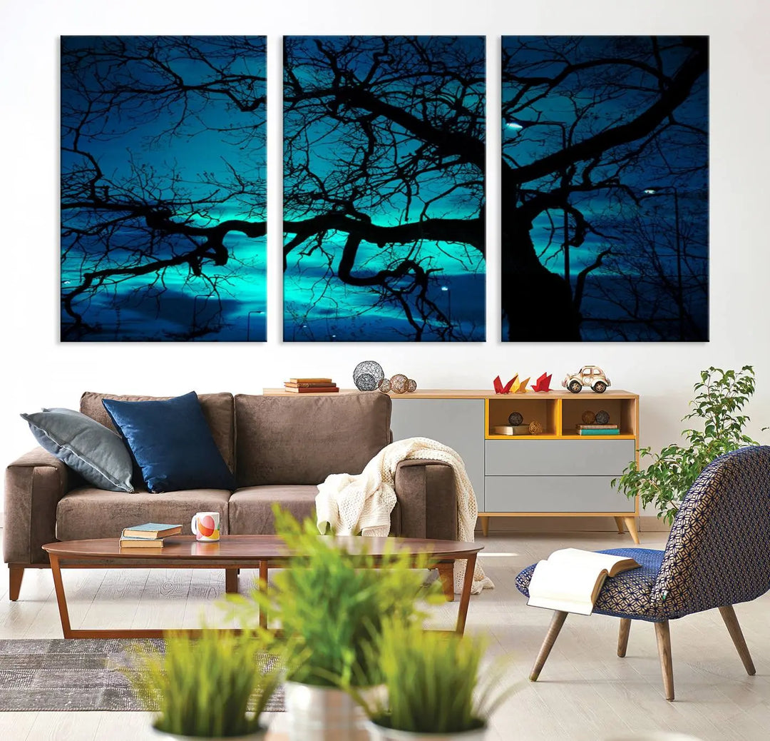 The Mystic Dark Forest Tree Wall Art Canvas Print showcases a tree silhouette set against a teal sky. Crafted on museum-quality canvas and gallery wrapped, it includes a UV-protective coating for lasting vibrancy.