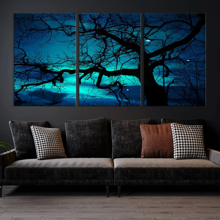 The Mystic Dark Forest Tree Wall Art Canvas Print showcases a tree silhouette set against a teal sky. Crafted on museum-quality canvas and gallery wrapped, it includes a UV-protective coating for lasting vibrancy.