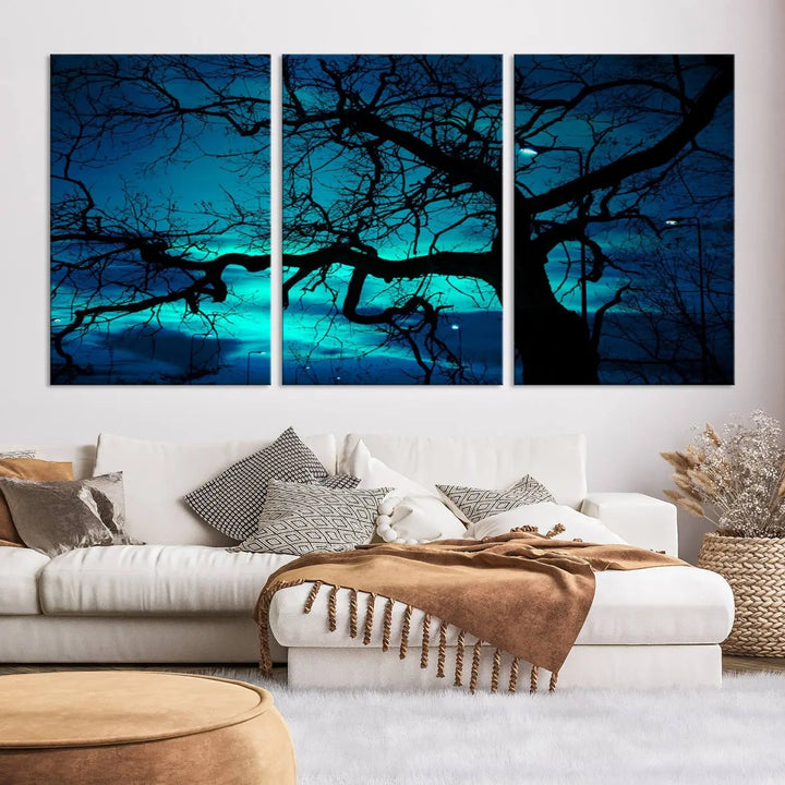 The Mystic Dark Forest Tree Wall Art Canvas Print showcases a tree silhouette set against a teal sky. Crafted on museum-quality canvas and gallery wrapped, it includes a UV-protective coating for lasting vibrancy.