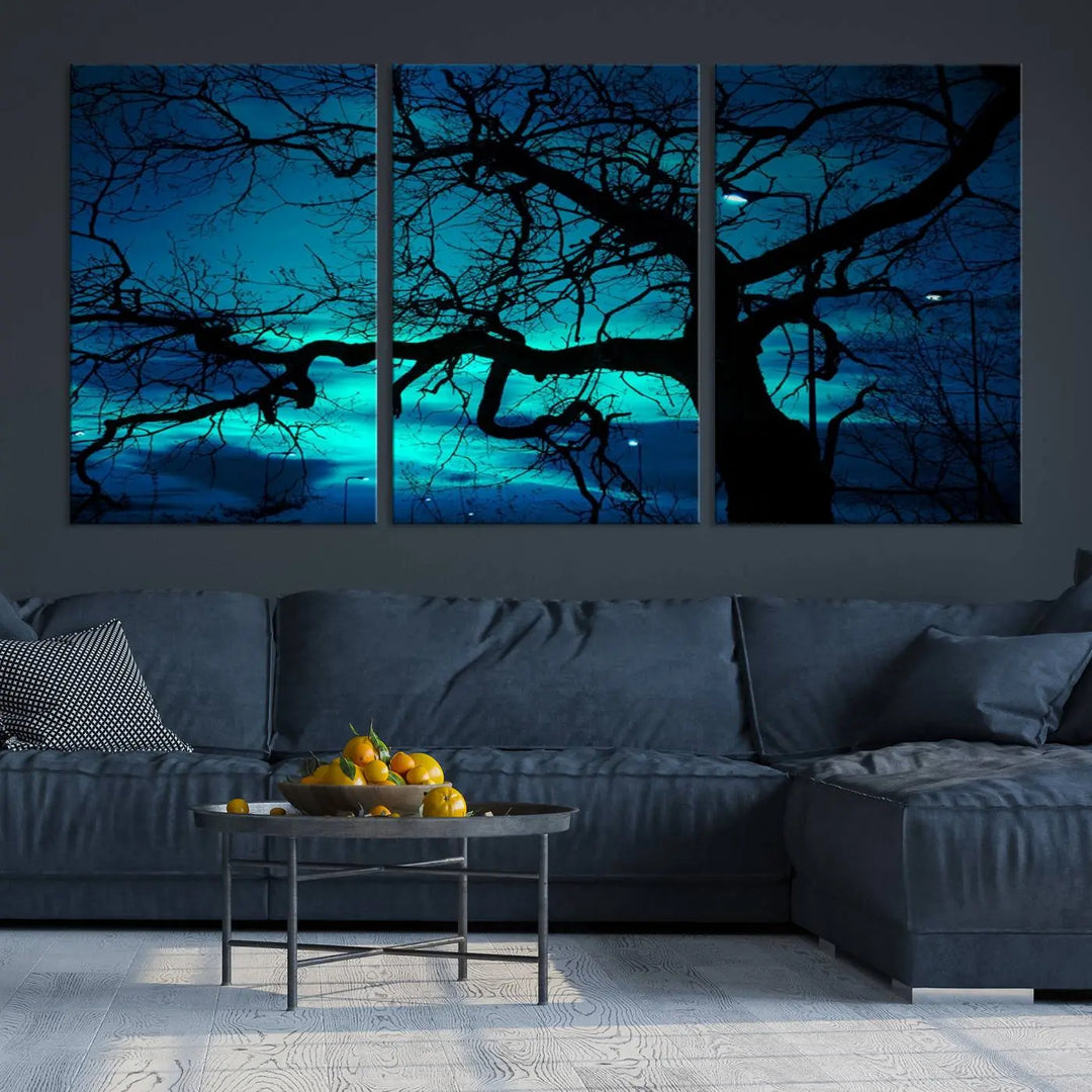 The Mystic Dark Forest Tree Wall Art Canvas Print showcases a tree silhouette set against a teal sky. Crafted on museum-quality canvas and gallery wrapped, it includes a UV-protective coating for lasting vibrancy.