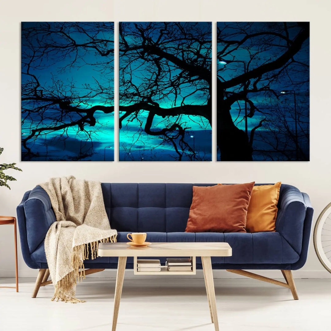 The Mystic Dark Forest Tree Wall Art Canvas Print showcases a tree silhouette set against a teal sky. Crafted on museum-quality canvas and gallery wrapped, it includes a UV-protective coating for lasting vibrancy.