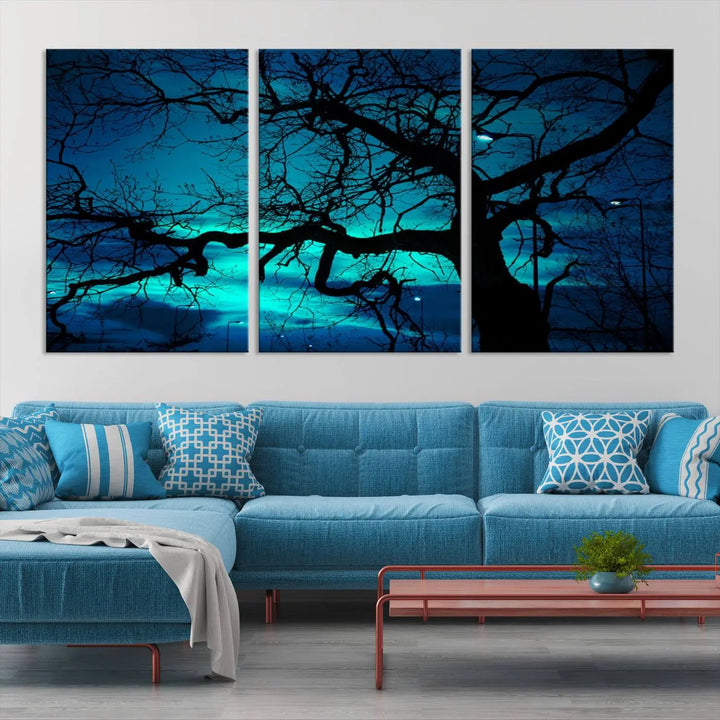 The Mystic Dark Forest Tree Wall Art Canvas Print showcases a tree silhouette set against a teal sky. Crafted on museum-quality canvas and gallery wrapped, it includes a UV-protective coating for lasting vibrancy.