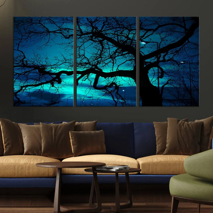 The Mystic Dark Forest Tree Wall Art Canvas Print showcases a tree silhouette set against a teal sky. Crafted on museum-quality canvas and gallery wrapped, it includes a UV-protective coating for lasting vibrancy.