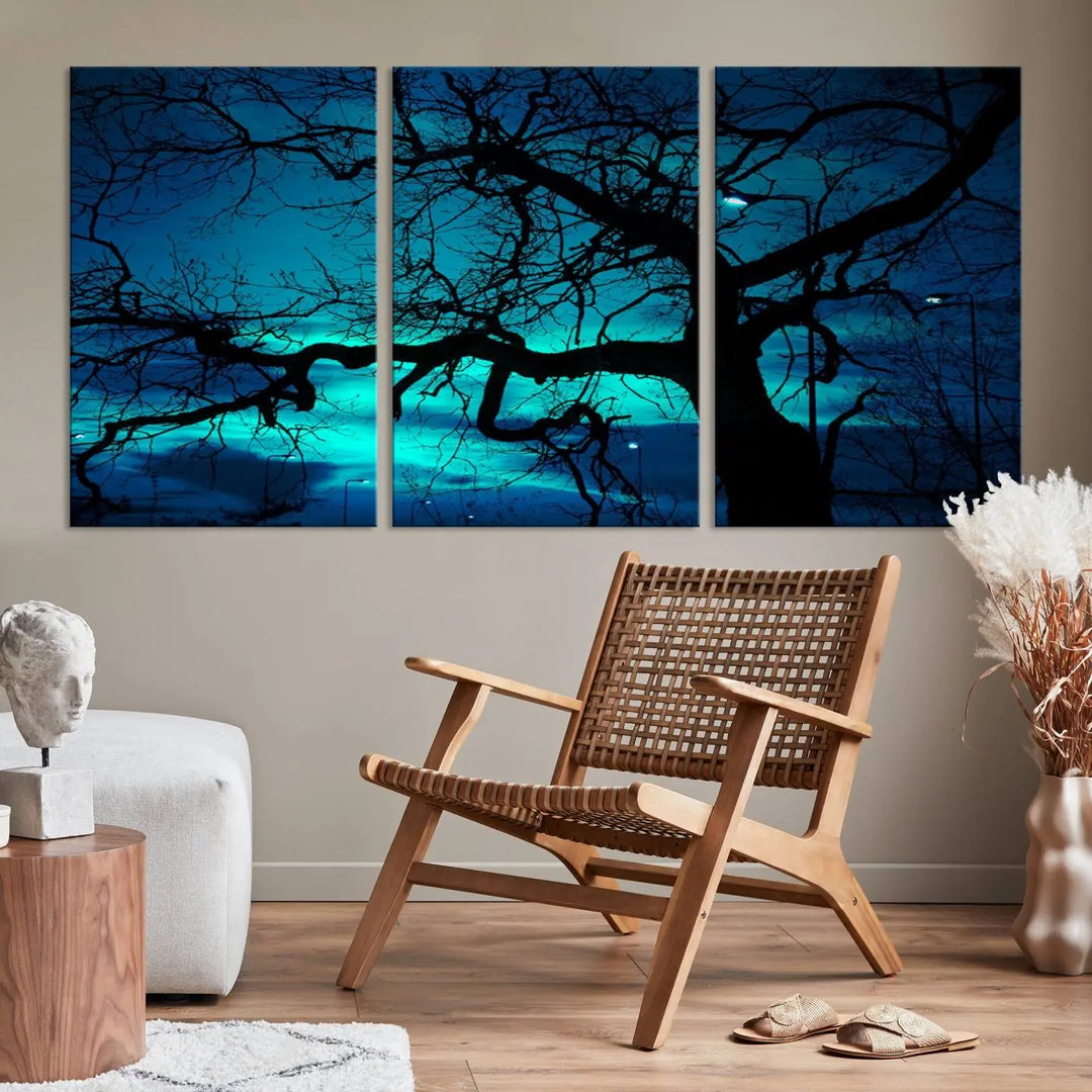 The Mystic Dark Forest Tree Wall Art Canvas Print showcases a tree silhouette set against a teal sky. Crafted on museum-quality canvas and gallery wrapped, it includes a UV-protective coating for lasting vibrancy.