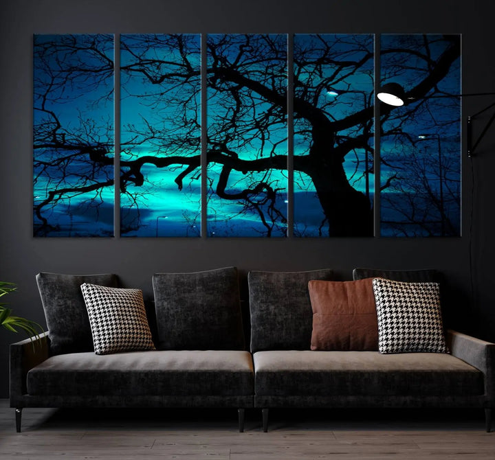 The Mystic Dark Forest Tree Wall Art Canvas Print showcases a tree silhouette set against a teal sky. Crafted on museum-quality canvas and gallery wrapped, it includes a UV-protective coating for lasting vibrancy.