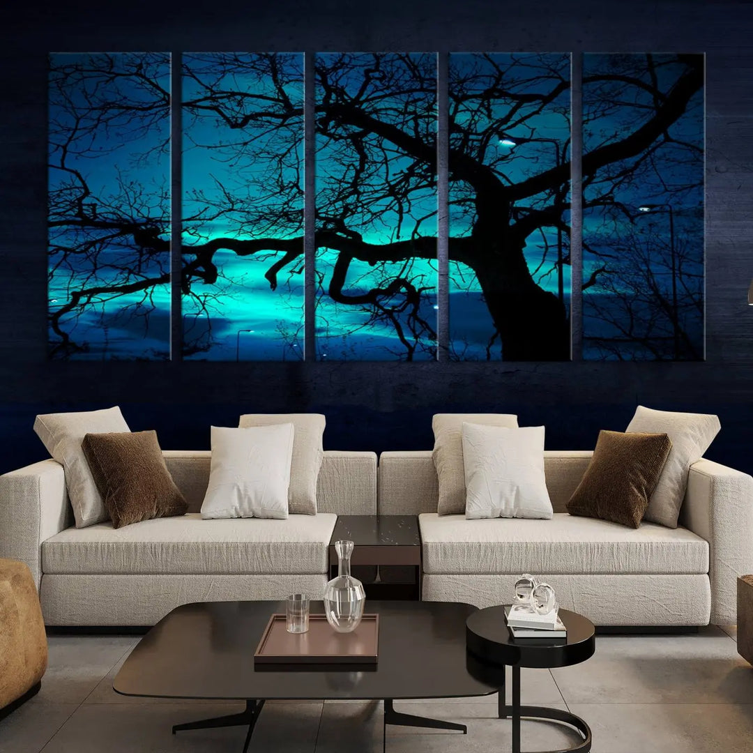 The Mystic Dark Forest Tree Wall Art Canvas Print showcases a tree silhouette set against a teal sky. Crafted on museum-quality canvas and gallery wrapped, it includes a UV-protective coating for lasting vibrancy.