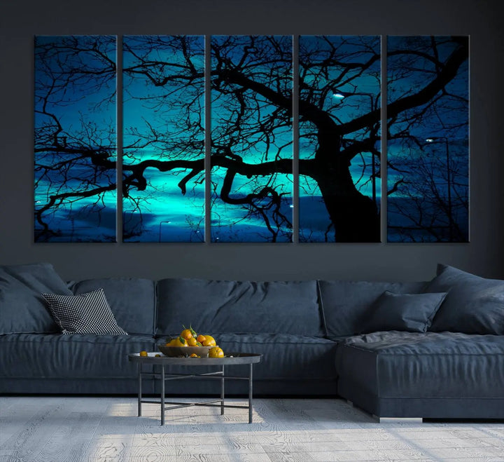 The Mystic Dark Forest Tree Wall Art Canvas Print showcases a tree silhouette set against a teal sky. Crafted on museum-quality canvas and gallery wrapped, it includes a UV-protective coating for lasting vibrancy.