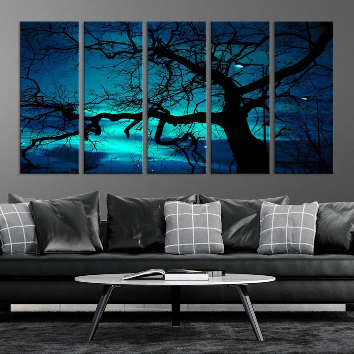 The Mystic Dark Forest Tree Wall Art Canvas Print showcases a tree silhouette set against a teal sky. Crafted on museum-quality canvas and gallery wrapped, it includes a UV-protective coating for lasting vibrancy.