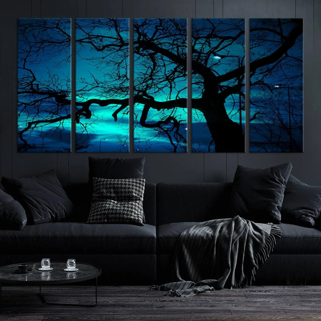 The Mystic Dark Forest Tree Wall Art Canvas Print showcases a tree silhouette set against a teal sky. Crafted on museum-quality canvas and gallery wrapped, it includes a UV-protective coating for lasting vibrancy.