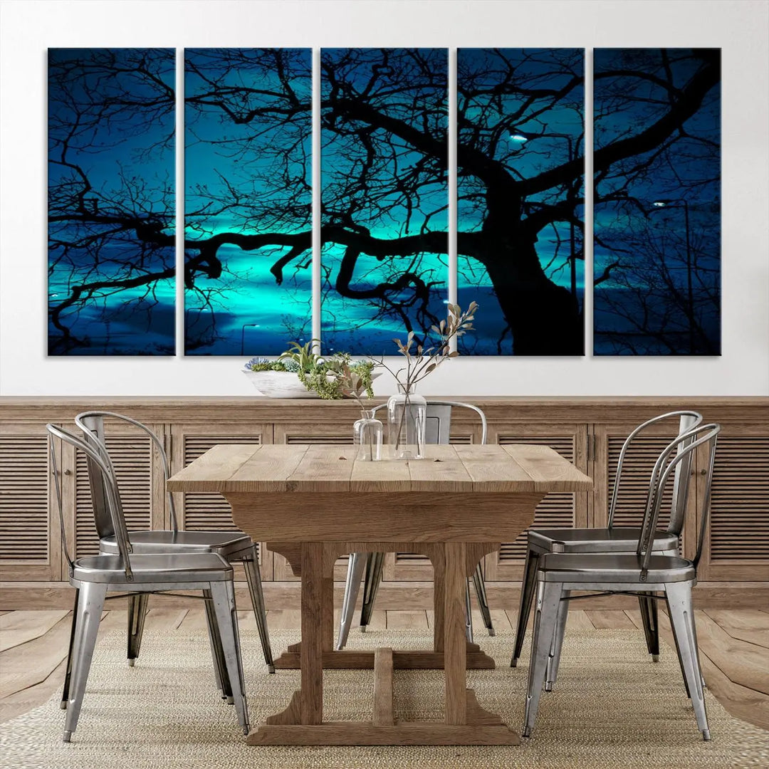 The Mystic Dark Forest Tree Wall Art Canvas Print showcases a tree silhouette set against a teal sky. Crafted on museum-quality canvas and gallery wrapped, it includes a UV-protective coating for lasting vibrancy.