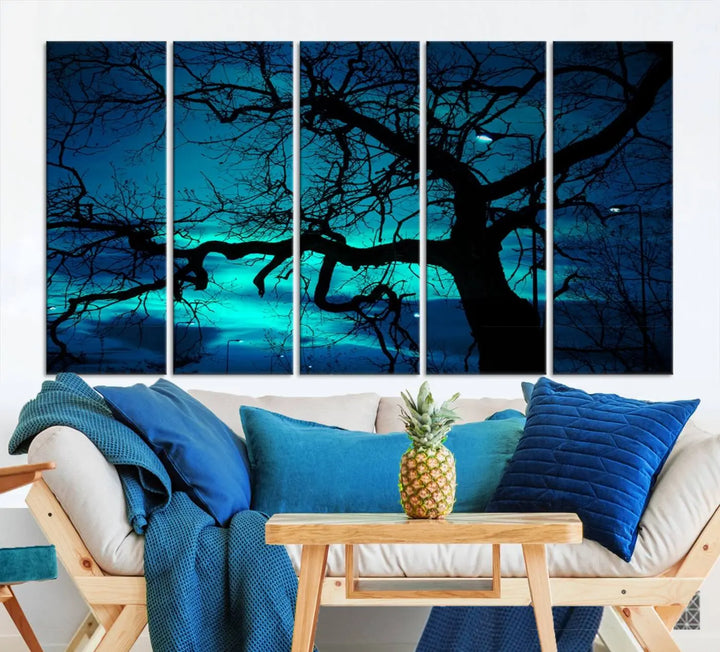 The Mystic Dark Forest Tree Wall Art Canvas Print showcases a tree silhouette set against a teal sky. Crafted on museum-quality canvas and gallery wrapped, it includes a UV-protective coating for lasting vibrancy.