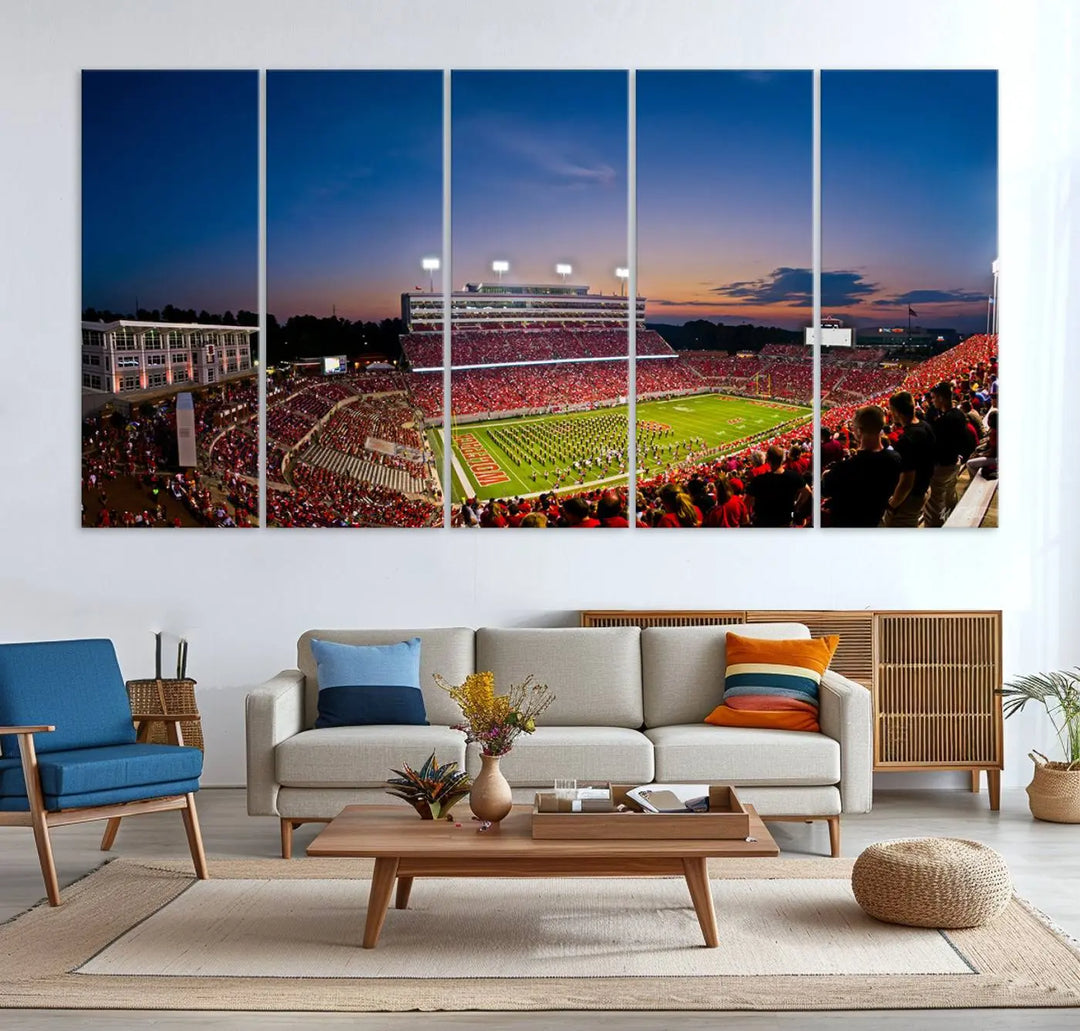 A thrilling college football game is captured in the NC State Wolfpack Football Team Print, featuring a triptych wall art of the packed Carter-Finley Stadium at sunset, showcasing NC State Wolfpack fans and players on the field.