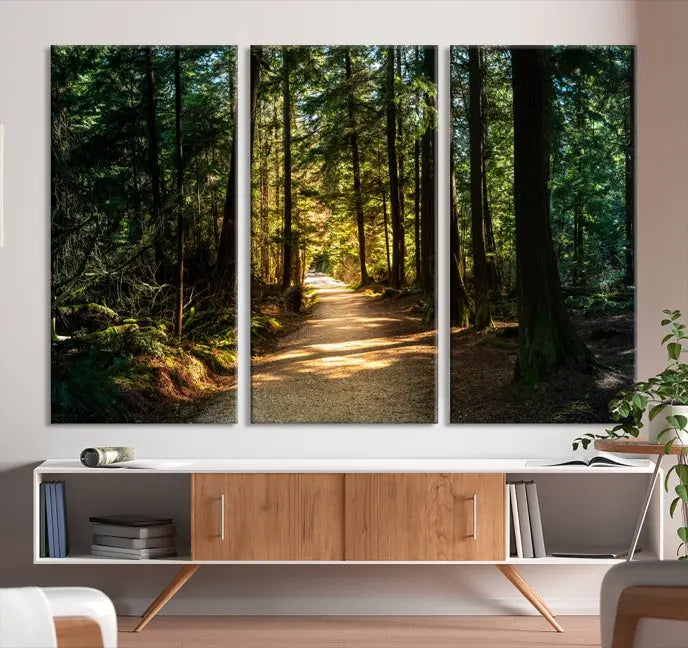 The Natural Landscape Wall Art Relaxing Forest Canvas Print features a triptych design showcasing a sunlit forest path, printed on premium museum-quality canvas with UV-protective coating. This beautiful artwork offers an oasis of tranquility and enhances your space. Enjoy free shipping on this stunning piece.